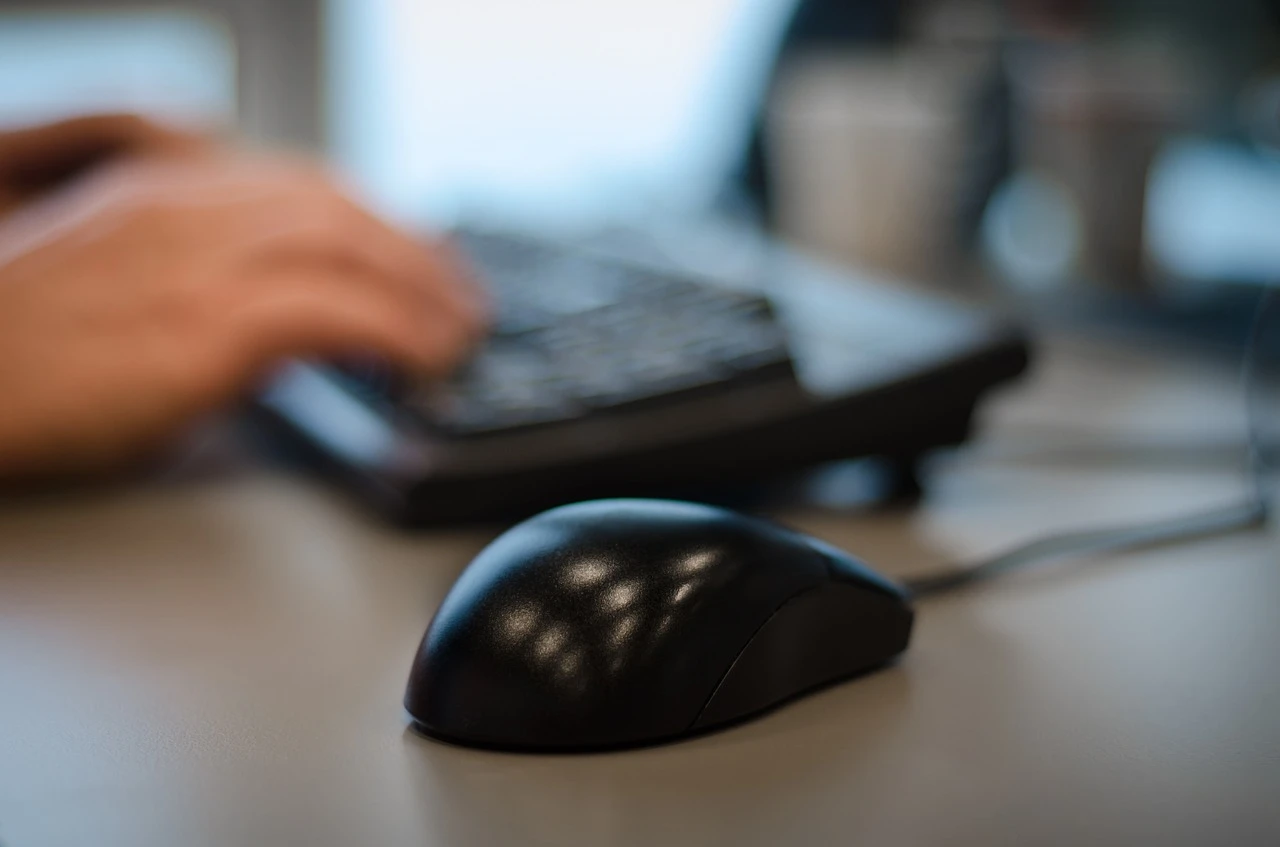 Person typing on the keyboard